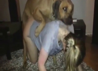 Blonde babe with a round ass fucking a dog